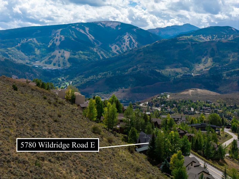 Aerial view locating 5780 Wildridge Road E with ski-slope views