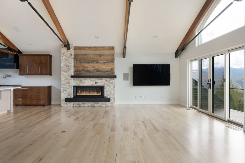 Living room with stone-and-reclaimed-wood fireplace