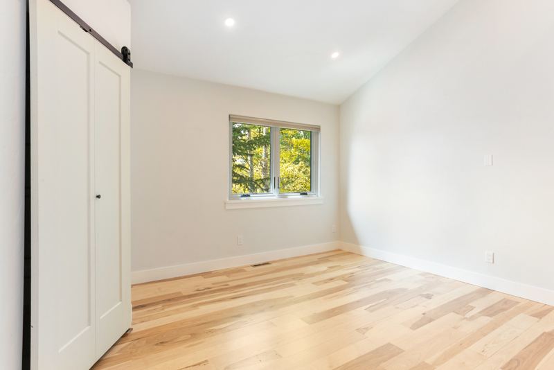 Upstairs bedroom with barn-door closet