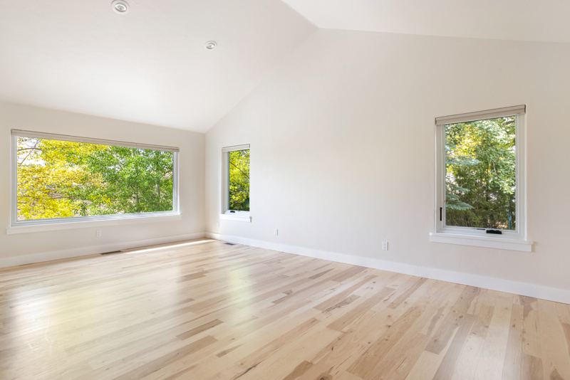 Primary suite with vaulted ceiling and aspen views