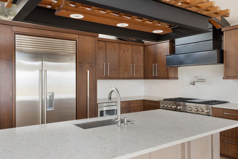 Kitchen island with Sub-Zero refrigerator and pro range