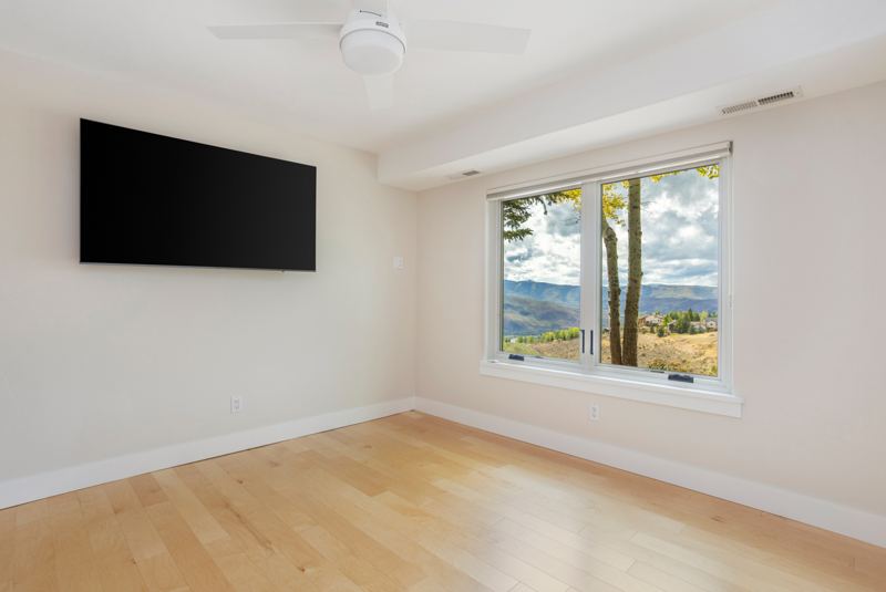 Bedroom with window views of the valley